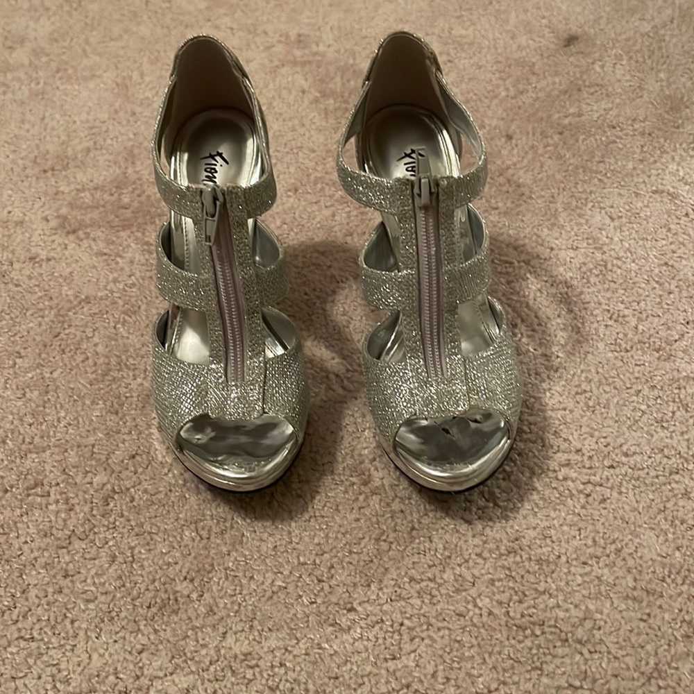 Silver high heels with a zipper on the front